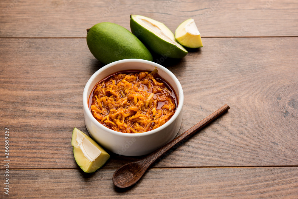 Mango Chunda or Sakhar Amba is a traditional indian summer recipe made using accha aam preserved in sugar syrup for days. selective focus Mango Chunda or Sakhar Amba is a traditional indian summer recipe made using accha aam preserved in sugar syrup for days. selective focus