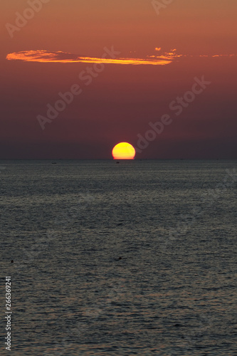 Fototapeta Naklejka Na Ścianę i Meble -  Beautiful amazing sunset on the Ionian Sea is unique, the beach of San Gregorio in Puglia in Italy