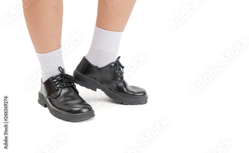 Asian Thai boy school student wear a black leather shoes