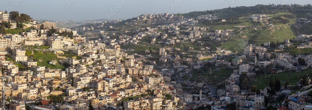 Aerial panoramic cityscape view of residential neighborhood during a cloudy day. Taken in Jerusalem, Israel.