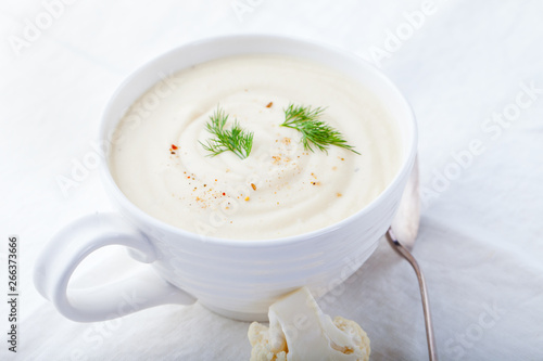 Cauliflower soup on a white background. Healthy food. Close up.