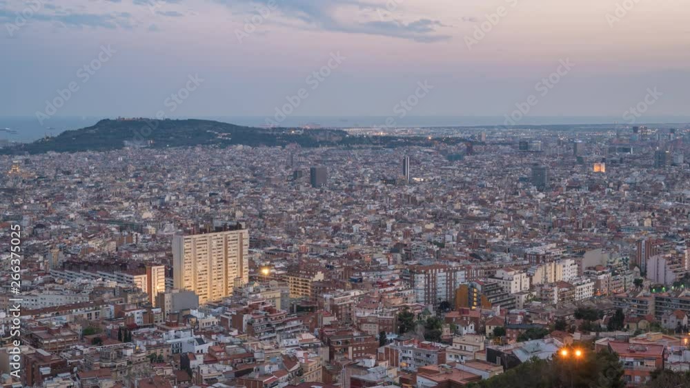 Barcelona Spain time lapse 4K, aerial view city skyline day to night timelapse from Bunkers del Carmel Barcelona Spain time lapse 4K, aerial view city skyline day to night timelapse from Bunkers del Carmel