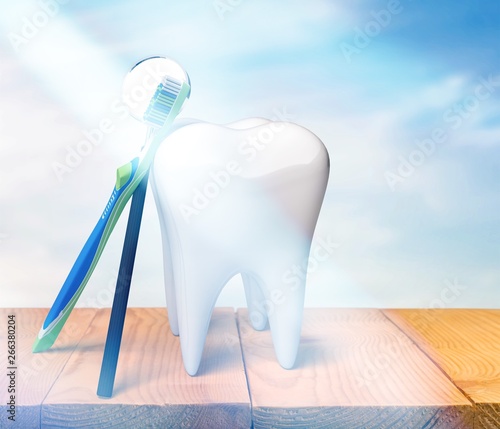 Big tooth model and toothbrush on light background