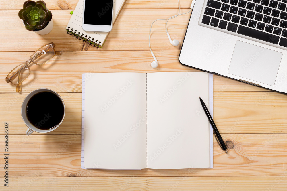 Working space. Laptop, notepad on wooden desk Working space. Laptop, notepad on wooden desk