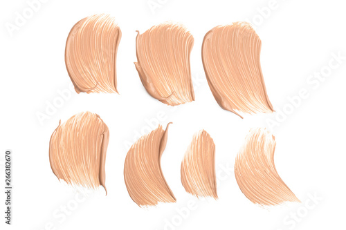 Light beige makeup smear of creamy foundation isolated on white background