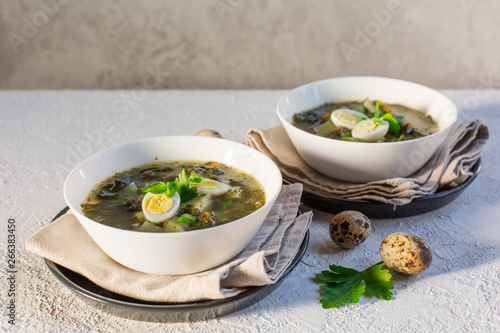 Green Sorrel soup - a soup made from broth, sorrel leaves, spinach,  eggs (hard boiled), potatoes, carrots, parsley root. Polish, Ukrainian, Belarusian, Russian, Jewish dish.