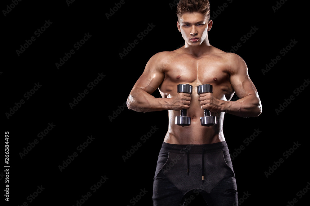 Muscular fitness sports man, atlete with dumbbell in fitness gym. Energy and power. Muscular fitness sports man, atlete with dumbbell in fitness gym. Energy and power.