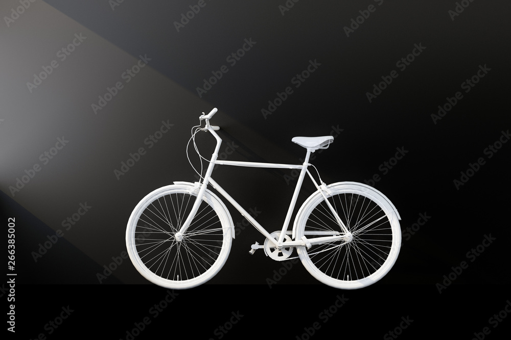 Fototapeta white bicycle with black wall