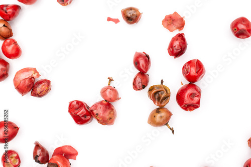Lot of whole dry peruvian pink pepper flatlay isolated on white background © PIXbank