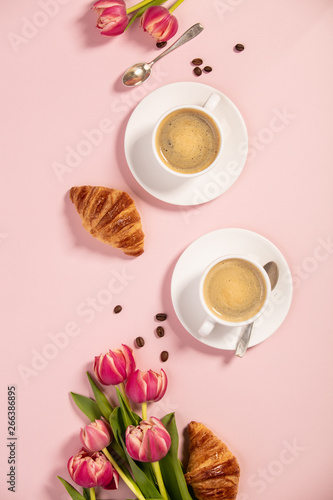 Morning coffee, croissants and a beautiful flowers. Flat lay