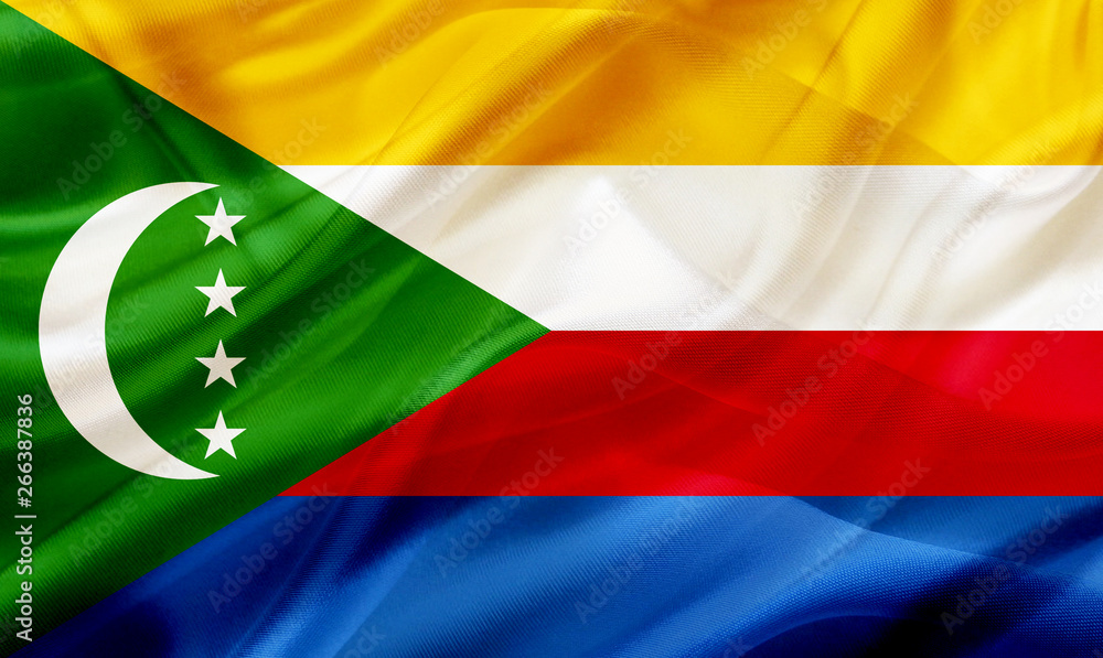 Obraz premium Comors Islands country flag on silk or silky waving texture