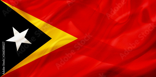 East Timor country flag on silk or silky waving texture