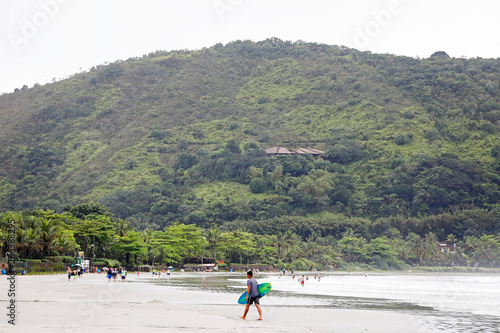 São Sebastiao, São Paulo, Brazil - October 14, 2018: Tourists in Whale Beach, located in the city of São Sebastião, on the coast of São Paulo State, in Brazil photo