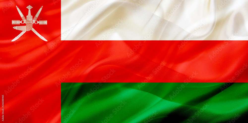 Obraz premium Oman country flag on silk or silky waving texture