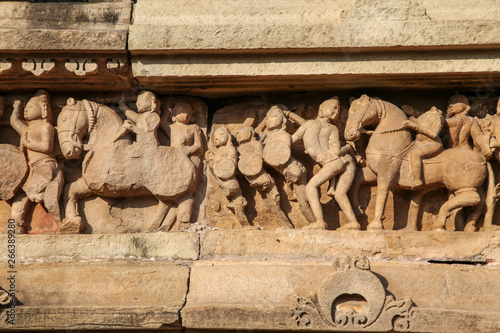 Фотография Sculptures depicting people having sex on the walls of ancient temples of Kama Sutra in India kajuraho
