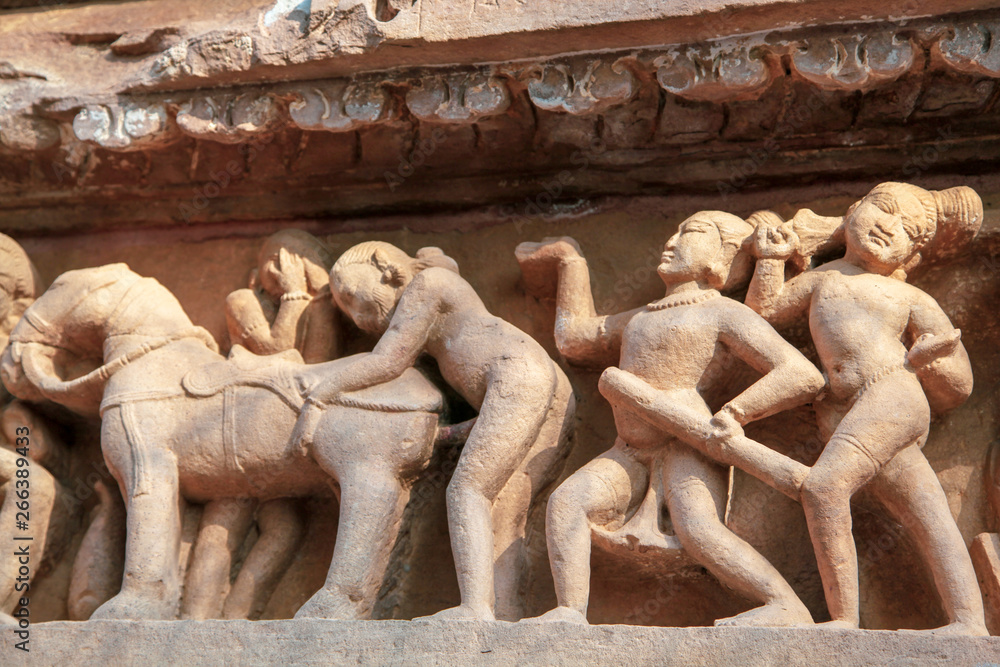 Sculptures depicting people having sex on the walls of ancient temples of  Kama Sutra in India kajuraho. UNESCO world heritage site. The most famous  landmark in India. Temple of love Stock Photo