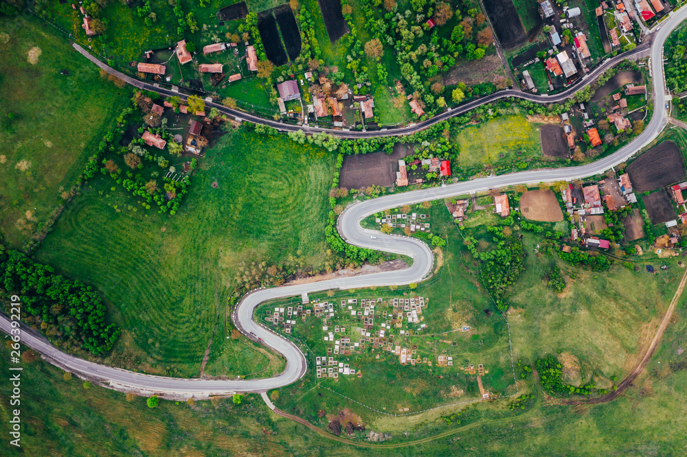 Obraz premium Curvy road from a drone view and agriculture fields