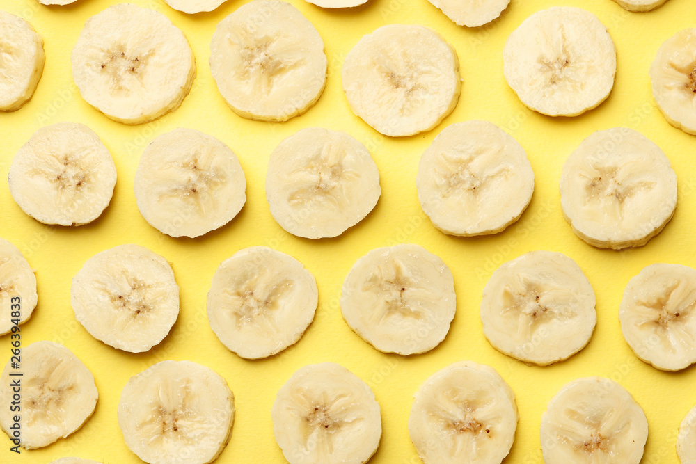 Creative summer pattern made of bananas slice on pastel yellow background. Fruit minimal concept. Flat lay. Creative summer pattern made of bananas slice on pastel yellow background. Fruit minimal concept. Flat lay.
