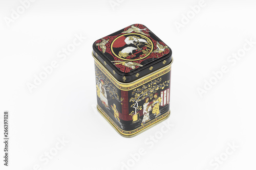 This chinese tea storage canister features classic oriental designs in red, black, gold and silver.