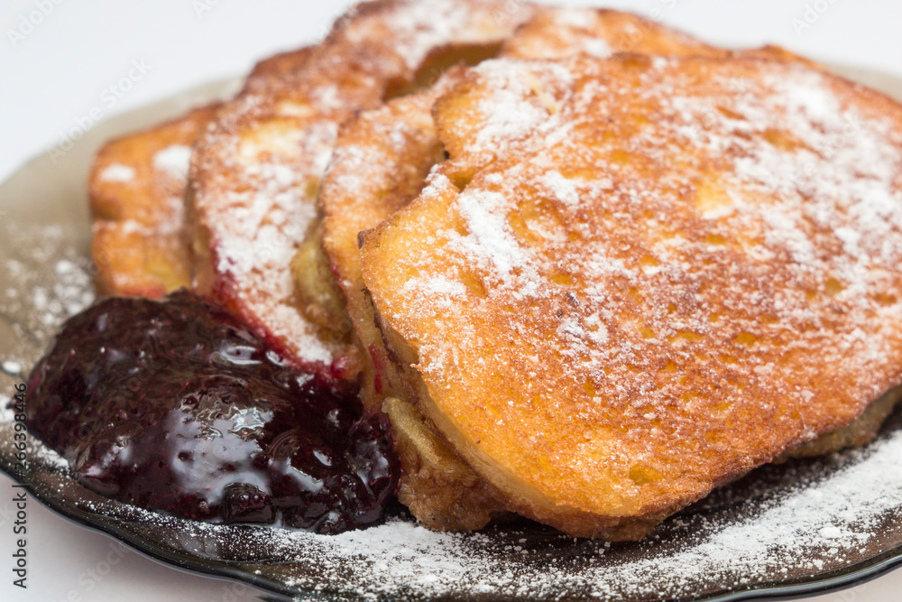 french toast with jam on black plate french toast with jam on black plate