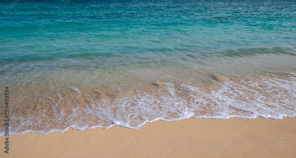 Waves on a sandy beach in Hawaii Waves on a sandy beach in Hawaii