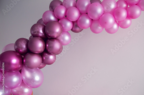 purple balloons of different sizes for the decoration of the holiday