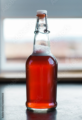 kombucha tea flavored with fruit juice on second ferment photo