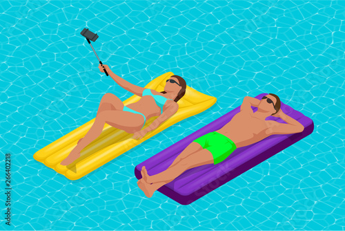 Inflatable ring and mattress. Young man nad woman on air mattress in the big swimming pool. Summer holiday idyllic. Enjoying suntan. Vacation concept. High view from above.