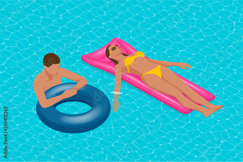 Inflatable ring and mattress. Young man nad woman on air mattress in the big swimming pool. Summer holiday idyllic. Enjoying suntan. Vacation concept. High view from above.