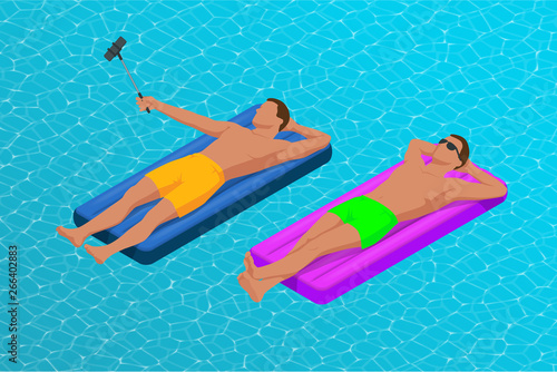 Inflatable ring and mattress. Young men on air mattress in the big swimming pool. Summer holiday idyllic. Enjoying suntan. Vacation concept. High view from above.