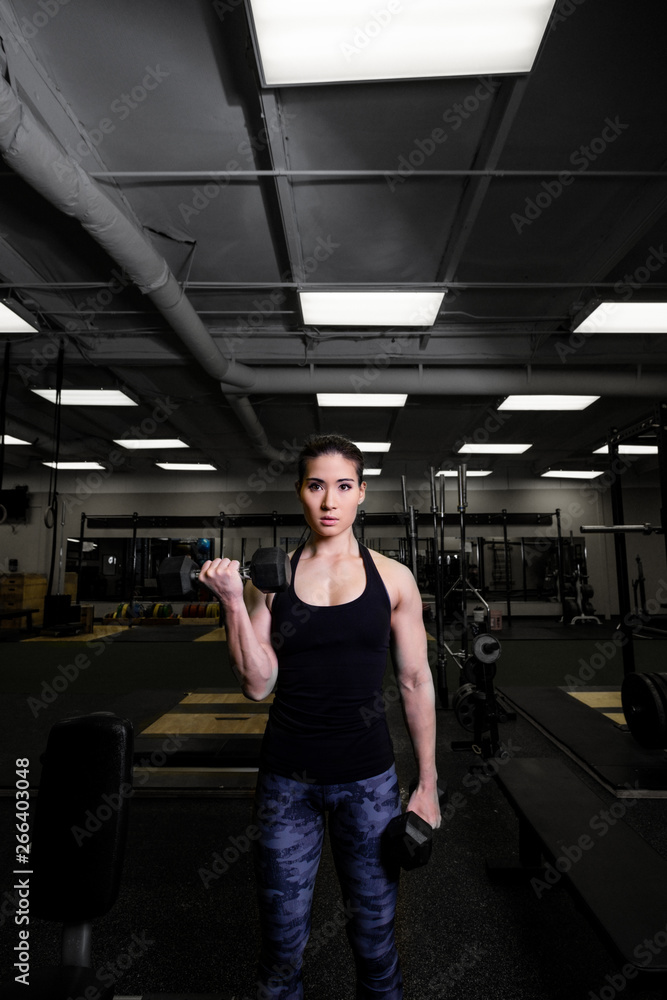 Mixed Race Woman Working Out in the Gym Mixed Race Woman Working Out in the Gym