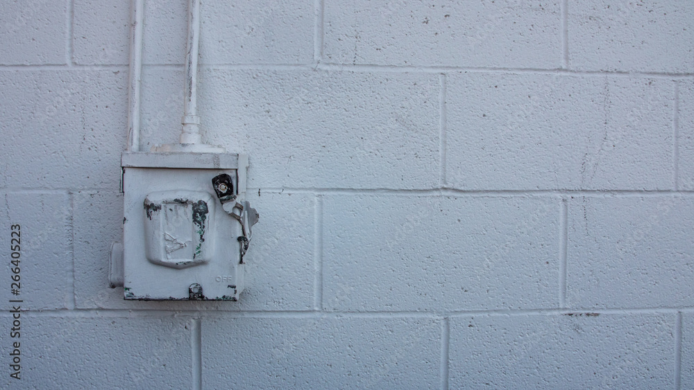 Electrical Breaker Box on White Cinder Block Wall Electrical Breaker Box on White Cinder Block Wall