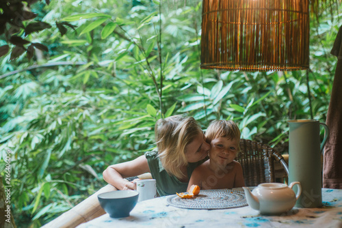 Mother With Son Breakfast In Morning On Terrace photo