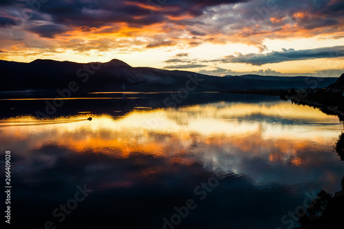 sunset over the lake in pigadakia, greece
