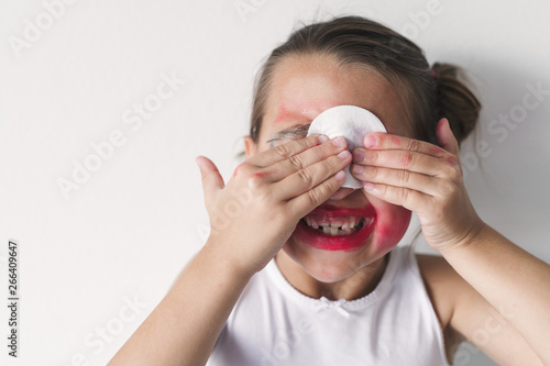 A Girl Covered In Makeup Takes It Off