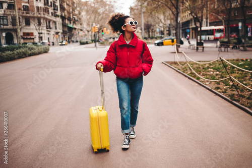 Young female tourist in the city streets photo