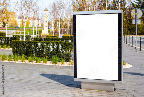 Obraz na płótnie Vertical small billboard in the city on the sidewalk. Mock up for advertising or announcements w salonie