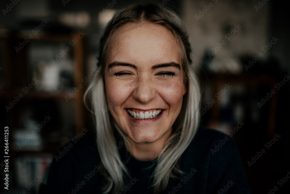 portrait of a laughing girl sitting in a wheelchair portrait of a laughing girl sitting in a wheelchair
