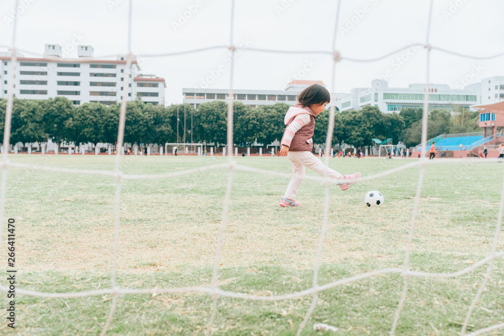 little girl playing football Stock Photo Adobe Stock