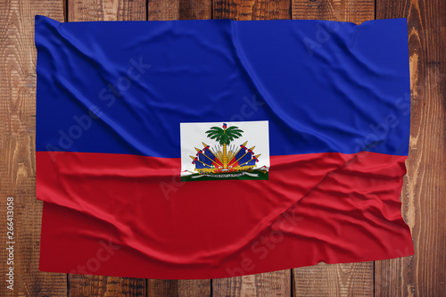 Φωτογραφία Flag of Haiti on a wooden table background