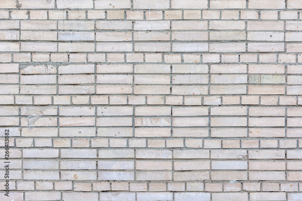 Blank background with place for text. Wall of small gray bricks. Neat brickwork.