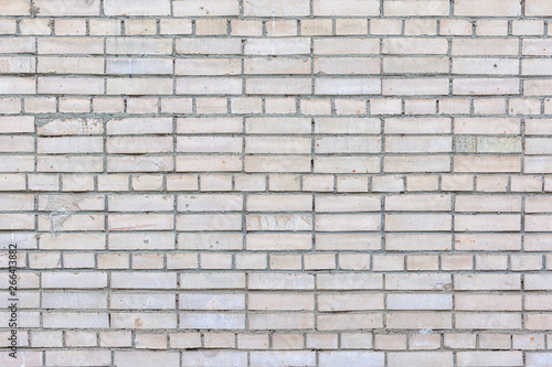 Blank background with place for text. Wall of small gray bricks. Neat brickwork.