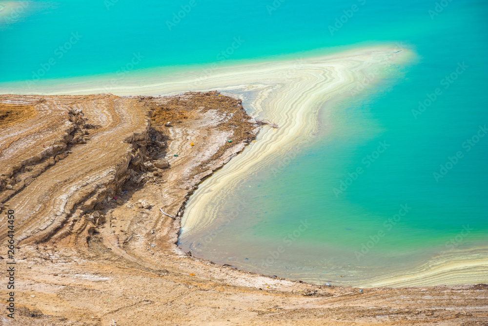 Desert landscape of Dead Sea coastline with white salt, Jordan, Israel