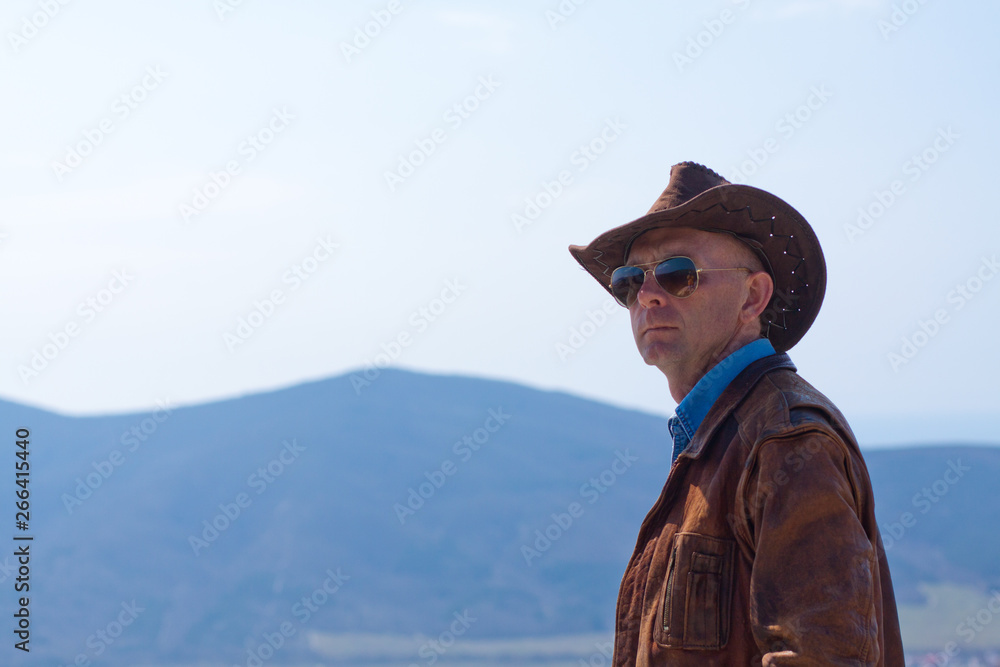 A man in a cowboy hat