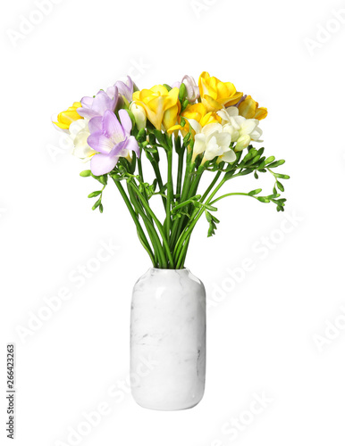 Fototapeta Naklejka Na Ścianę i Meble -  Bouquet of fresh freesia flowers in vase isolated on white
