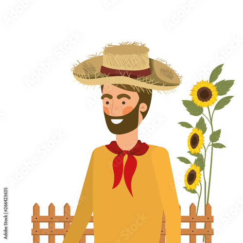 man farmer with straw hat and sunflowers