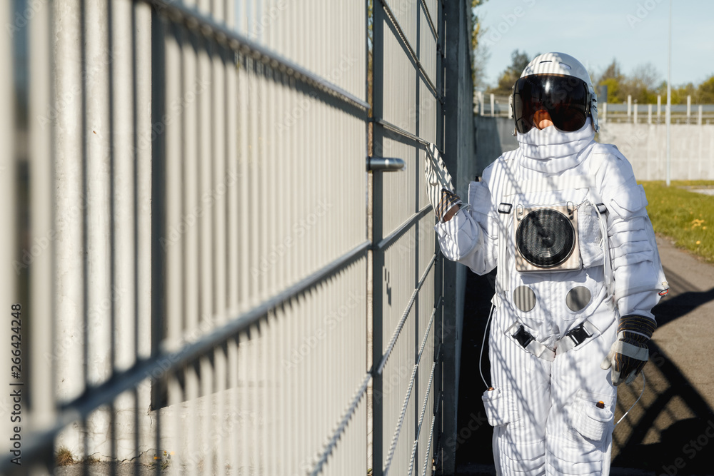 custom made wallpaper toronto digitalAstronaut on futuristic city background, glimpse at future. Fantastic Cosmic Costume.