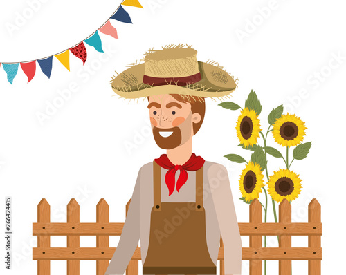 man farmer with straw hat and sunflowers