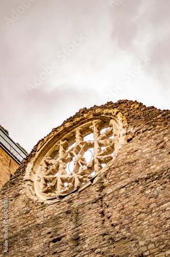 The ruined wall of bricks in london and also htere is window photo