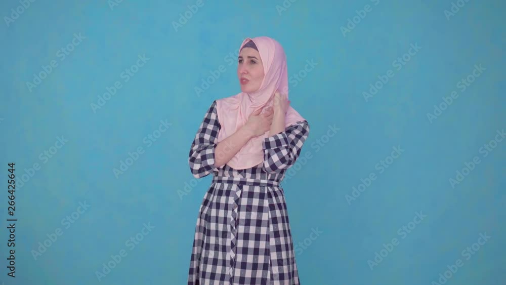 young beautiful Muslim woman having problems and neck pain young beautiful Muslim woman having problems and neck pain